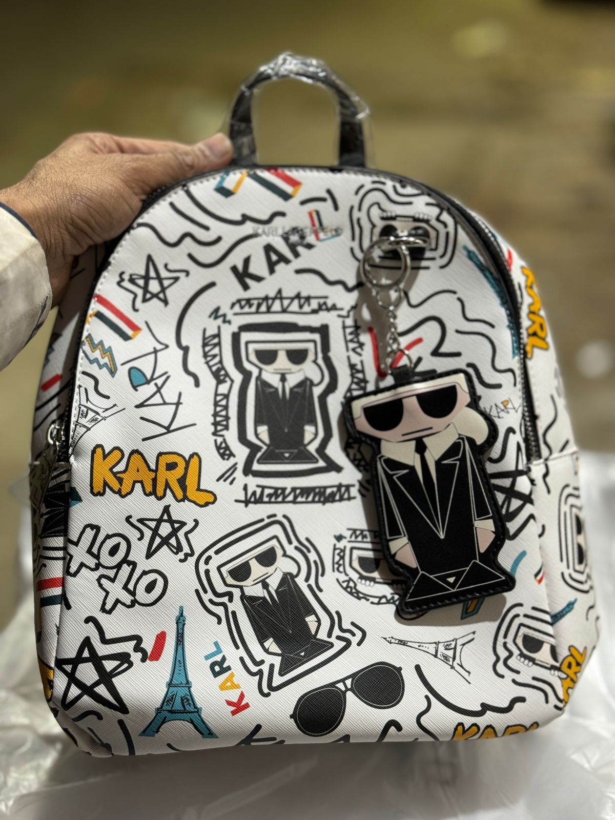 KIRL PRITED TASSLE BACPACK WITH DUST BAG HUMAN HAND BAG
