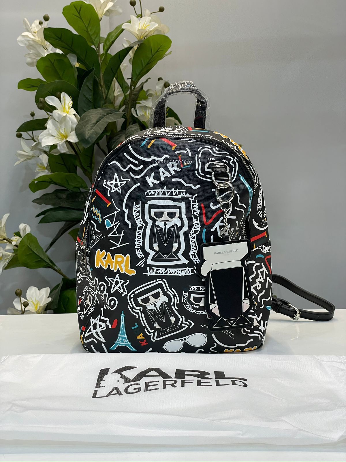 KIRL PRITED TASSLE BACPACK WITH DUST BAG HUMAN HAND BAG