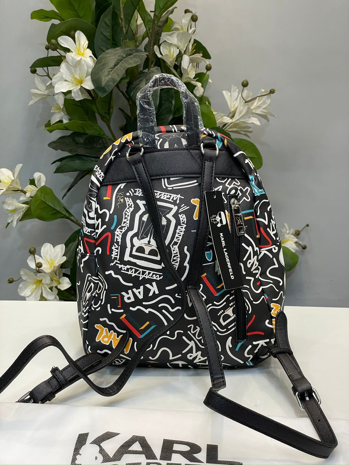 KIRL PRITED TASSLE BACPACK WITH DUST BAG HUMAN HAND BAG
